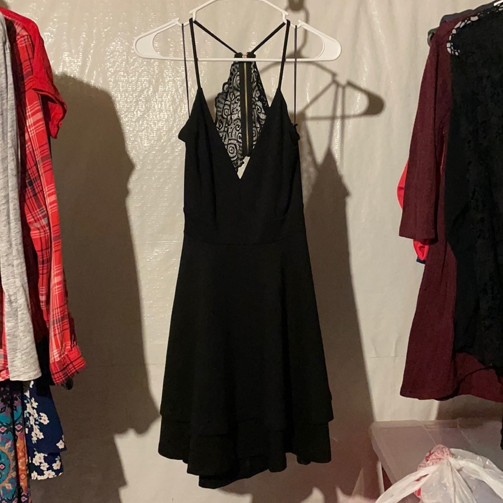 Black v neck dress. Open lace back. Size L. Never worn.